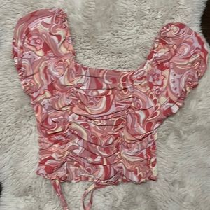 Cropped pink marble shirt.